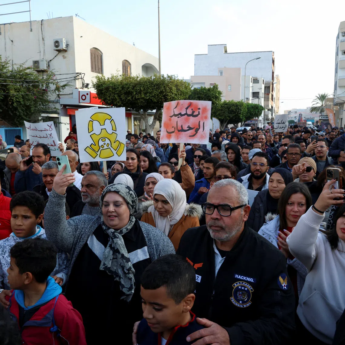 People march on the 15th anniversary of the 2011 uprising to protest over pollution caused by chemical emissions from the state-owned Tunisian Chemical Group's phosphate complex, demanding its closure, in Gabes, Tunisia December 17, 2025. REUTERS/Khaled Nasraoui