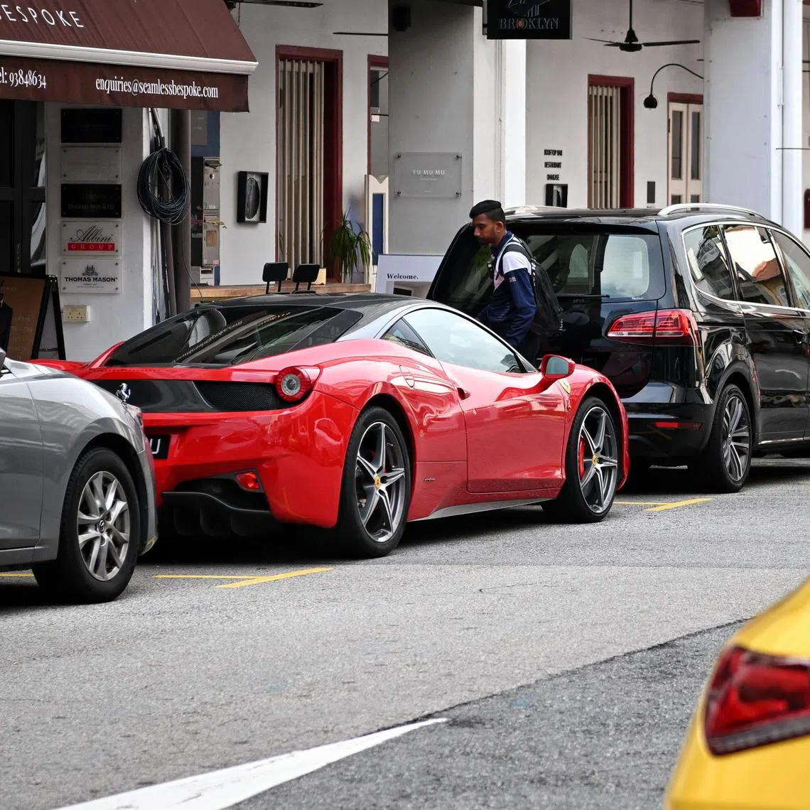 ST20231023_202390152926 Kua Chee Siong/ pixgeneric/

Generic pix of a parking attendant issuing a parking ticket to a Ferarri parked along Ann Siang Road on Oct 23, 2023.