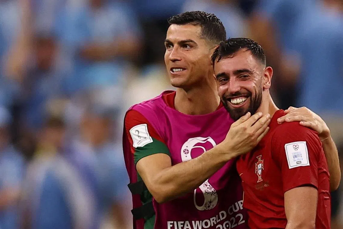 Soccer Football - FIFA World Cup Qatar 2022 - Group H - Portugal v Uruguay - Lusail Stadium, Lusail, Qatar - November 28, 2022
Portugal's Cristiano Ronaldo and Bruno Fernandes celebrate after the match REUTERS/Kai Pfaffenbach