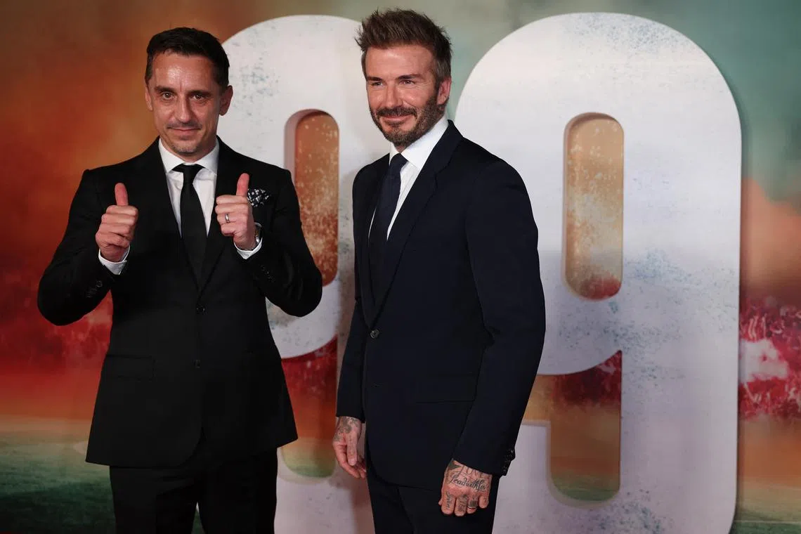 FILE PHOTO: Soccer Football - '99' World Premiere - Printworks, Manchester, Britain - May 9, 2024 Former Manchester United players David Beckham and Gary Neville pose on the red carpet before '99' World Premiere REUTERS/Phil Noble/File Photo