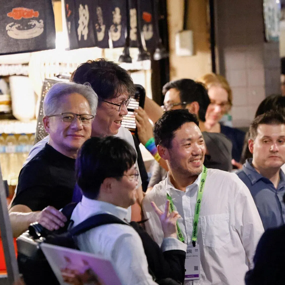 Nvidia CEO Jensen Huang (left) poses for a photo with executives from South Korean companies at a dinner outside a restaurant in Taipei on June 1.