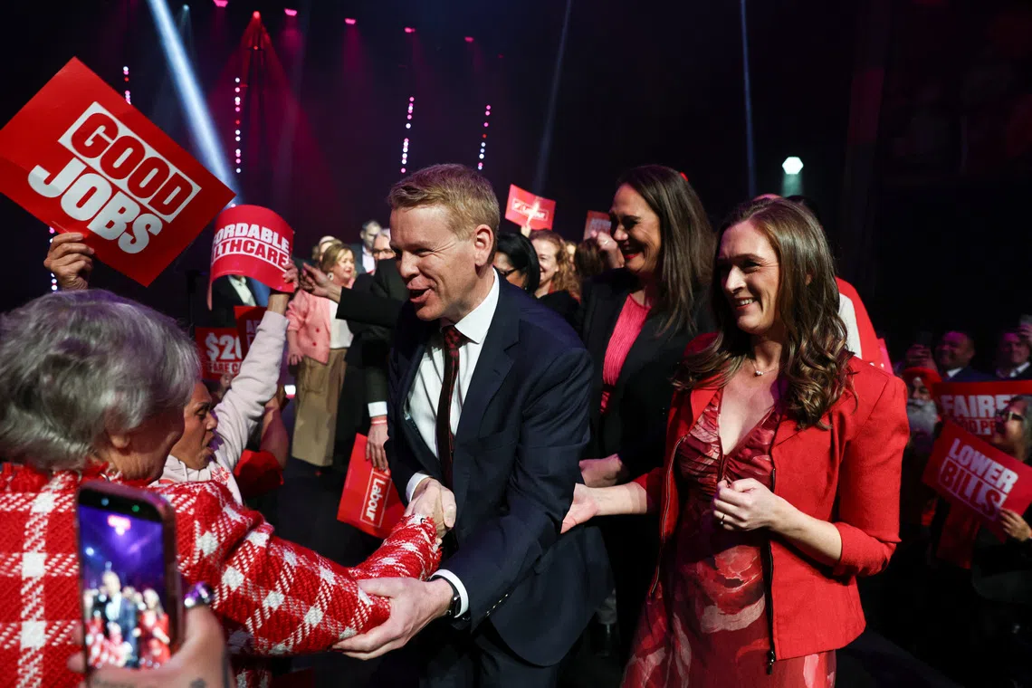 Labour Party Leader Chris Hipkins greets a supporter as his partner, Toni Grace, stands near him at the New Zealand Labour Party's election campaign launch event in Auckland, New Zealand, September 27, 2026. REUTERS/David Rowland