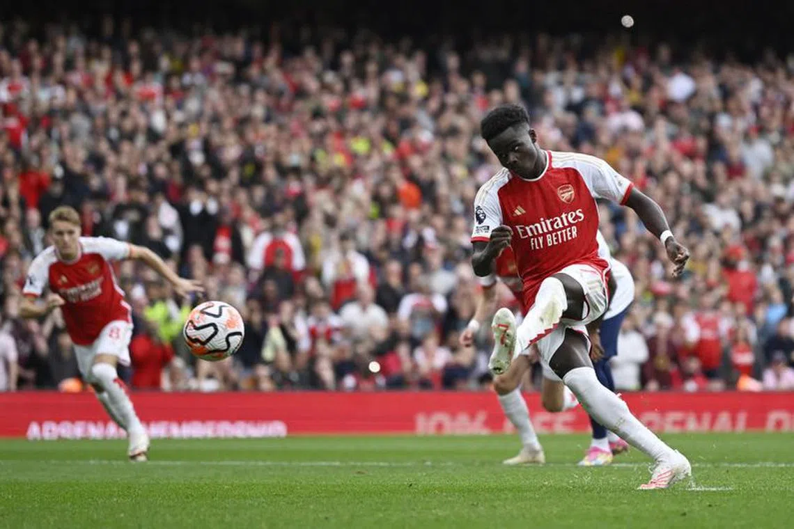 FILE PHOTO: Soccer Football - Premier League - Arsenal v Tottenham Hotspur - Emirates Stadium, London, Britain - September 24, 2023 Arsenal&#039;s Bukayo Saka scores their second goal from the penalty spot REUTERS/Tony Obrien/File Photo