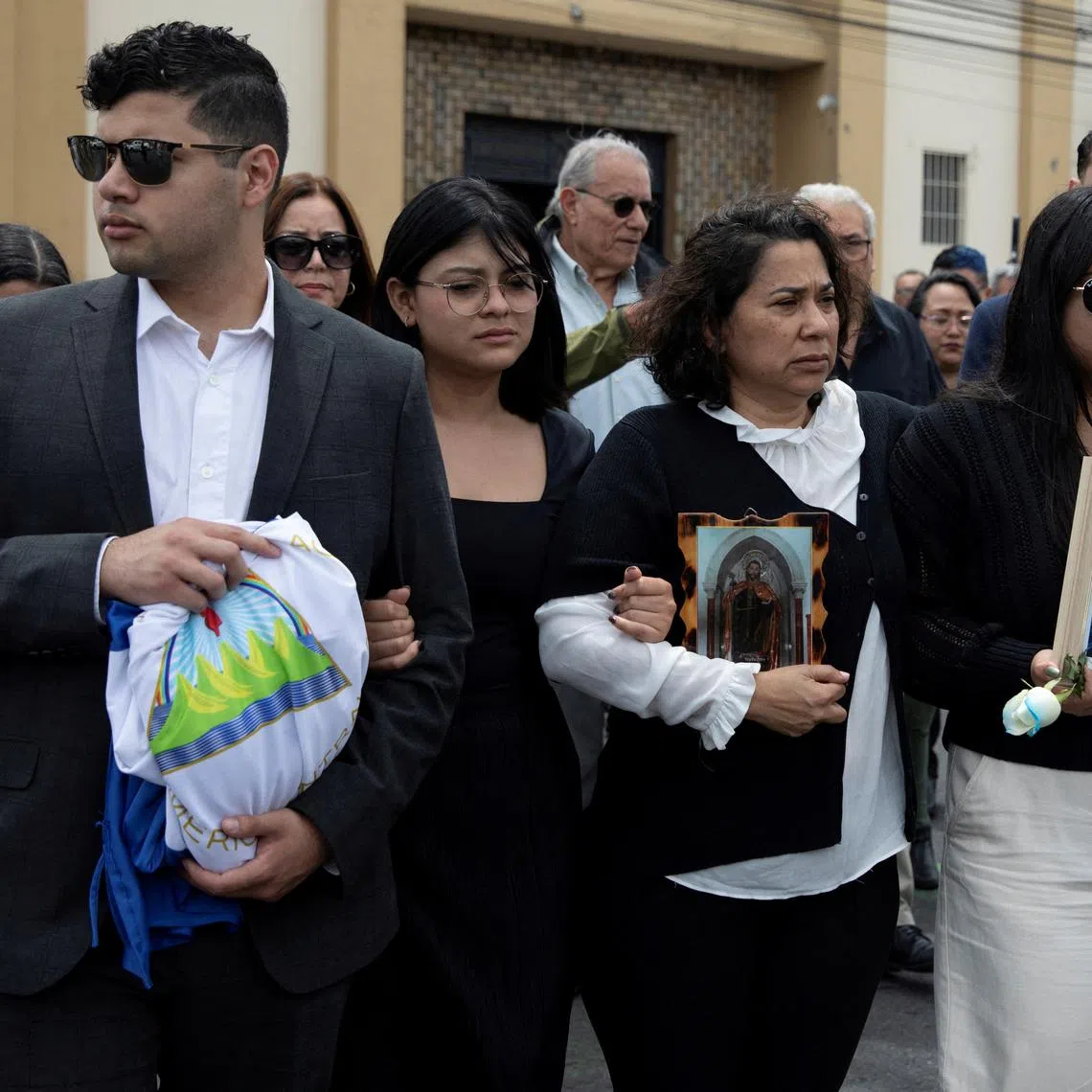 FILE PHOTO: Claudia Vargas and other relatives arrive for the funeral Mass of her husband, exiled former Nicaraguan military officer Roberto Samcam, a retired Sandinista major who was shot to death in his condo on June 19, in San Jose, Costa Rica June 22, 2025. REUTERS/Stringer/File Photo