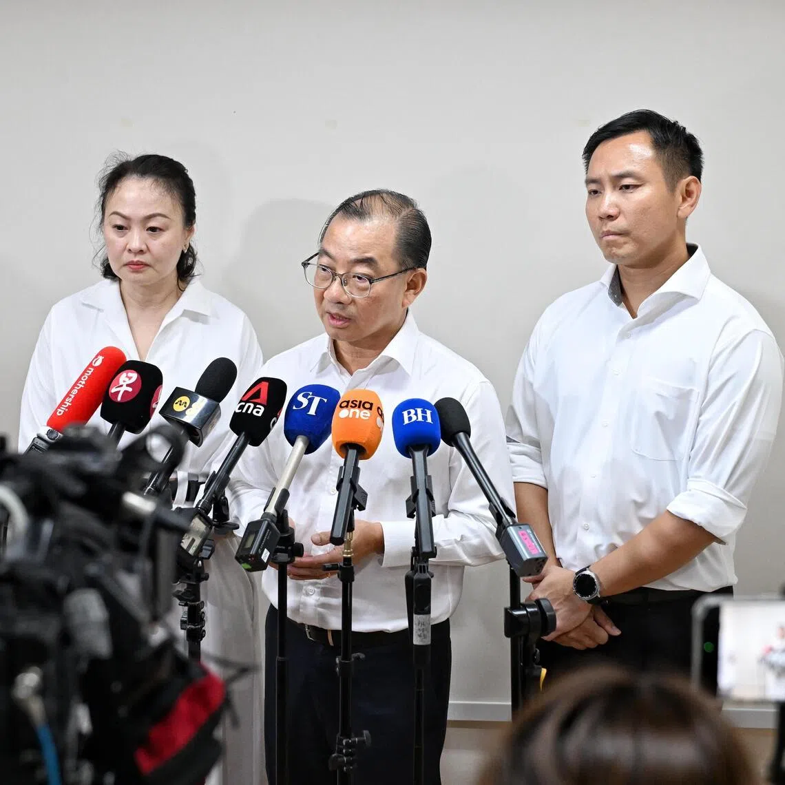Speaker of Parliament Seah Kian Peng (centre), flanked by fellow Marine Parade-Braddell Heights GRC MPs Diana Pang and Goh Pei Ming, speaking to the media on July 20.