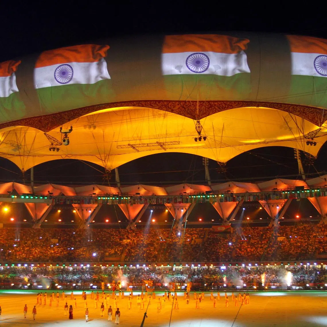 FILE PHOTO: The Indian national flag is projected onto a balloon during the Commonwealth Games closing ceremony at the Jawaharlal Nehru stadium in New Delhi October 14, 2010. REUTERS/B Mathur/File Photo