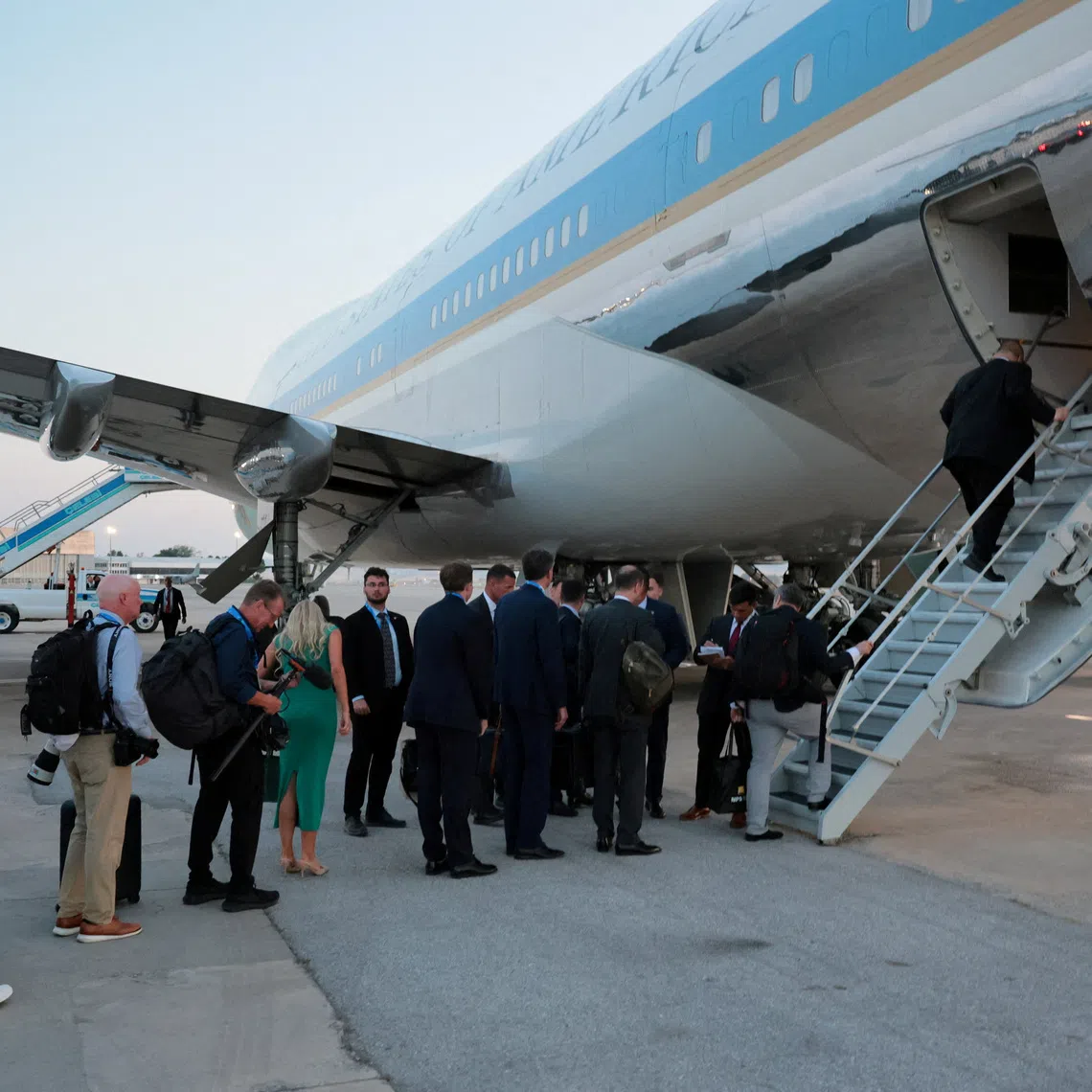 People board Air Force One carrying US President Donald Trump, en route to Washington after his participation in the NATO leaders’ summit, at Ankara Esenboga Airport, Turkey, on July 8.