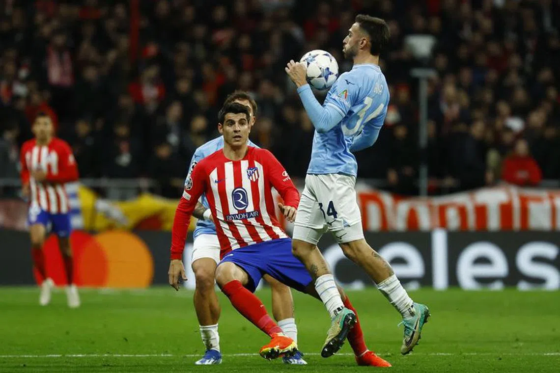 Soccer Football - Champions League - Group E - Atletico Madrid v Lazio - Metropolitano, Madrid, Spain - December 13, 2023 Lazio's Mario Gila in action with Atletico Madrid's Alvaro Morata REUTERS/Susana Vera
