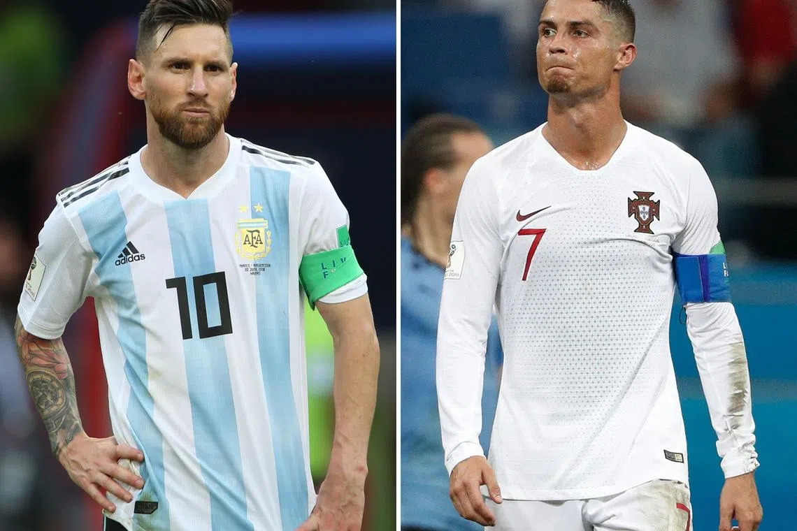 Argentina's forward Lionel Messi (l) and Portugal's forward Cristiano Ronaldo at the 2018 World Cup. Qatar is likely their last chance at winning football's biggest prize.
 / AFP PHOTO / Roman KRUCHININ AND Adrian DENNIS