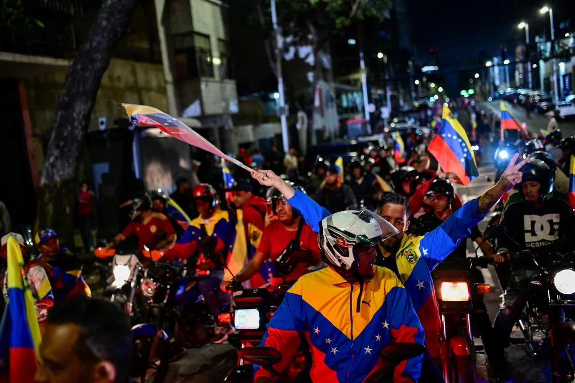 Supporters of Venezuela's President Nicolas Maduro celebrate after he won third term in the presidential election, in Caracas, Venezuela July 28, 2024. REUTERS/Maxwell Briceno