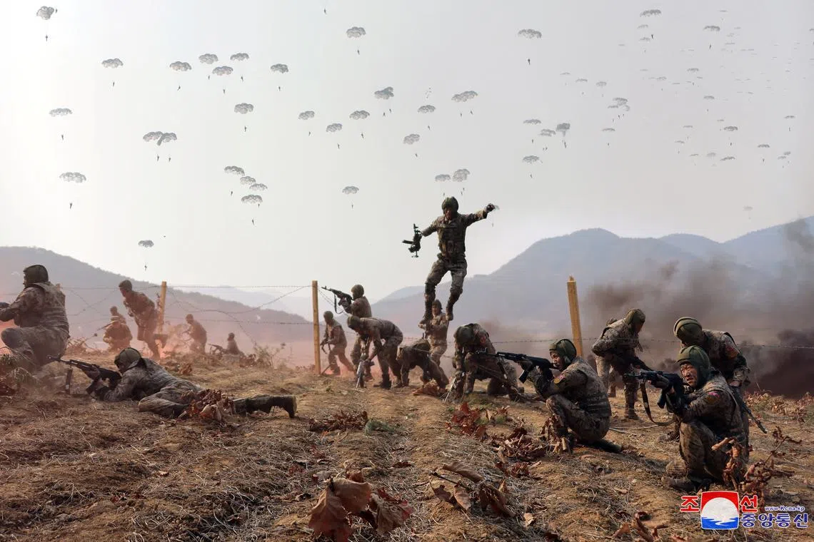 FILE PHOTO: Soldiers participate in a demonstration during the training of the Korean People's Army's air and amphibious combat units, in this picture released on March 16, 2024, by the Korean Central News Agency.  KCNA via REUTERS/File Photo