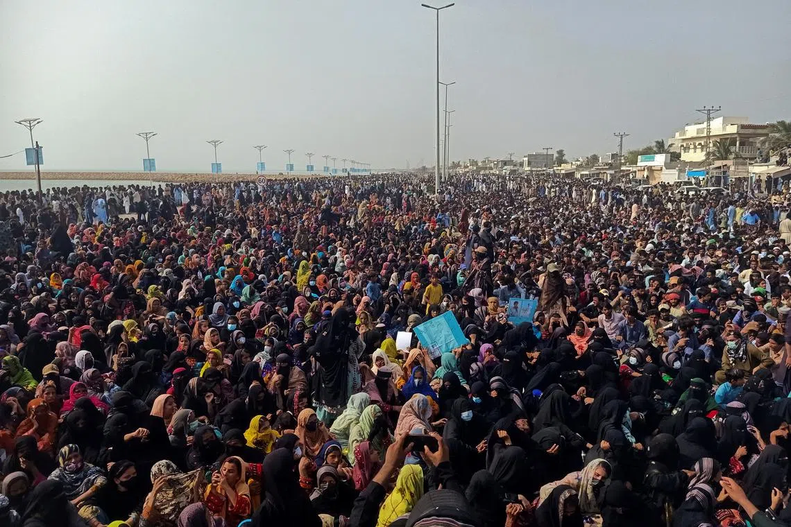 Supporters of the Balochistan Yakjehti Committee (BYC) listen to the speech of their leader during what they call the Baloch National Gathering in Gwadar, Pakistan July 28, 2024. REUTERS/Stringer