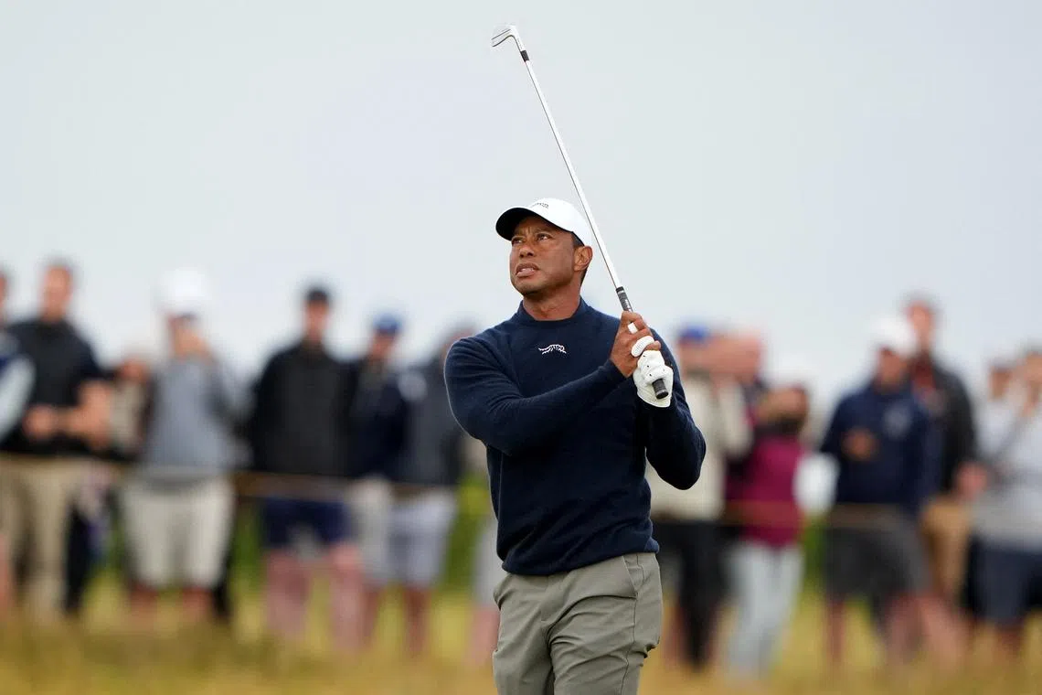 Golf - The 152nd Open Championship - Royal Troon Golf Club, Troon, Scotland, Britain - July 19, 2024 Tiger Woods of the U.S. hits his approach on the 3rd hole during the second round REUTERS/Maja Smiejkowska/ File Photo