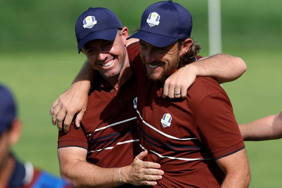 Team Europe's Rory McIlroy (left) and Tommy Fleetwood celebrate after winning the match on the 16th hole during the foursomes.