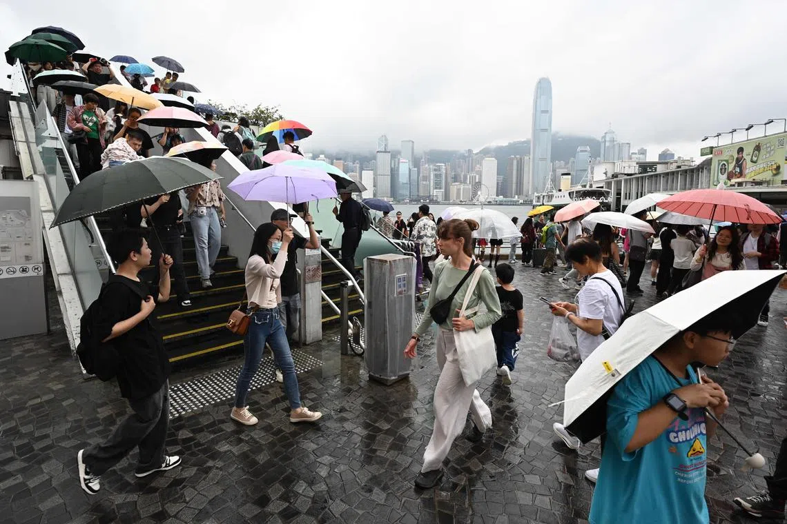 Tourists at the Tsim Sha Tsui waterfront in Hong Kong on May 1.