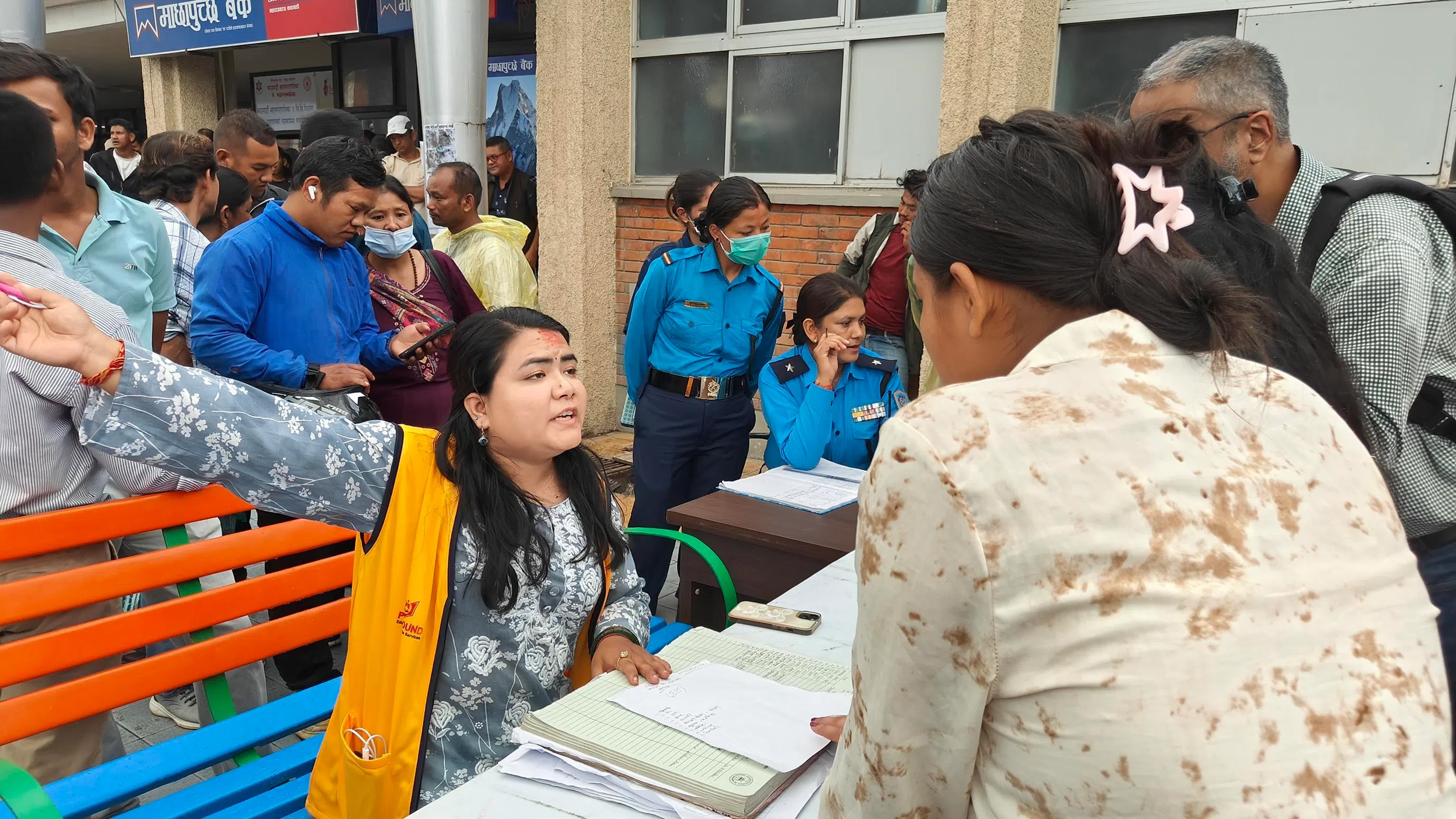 There are those who have put aside their personal tragedies to help others. Preksha K.C. whose maternal uncle is missing, is volunteering at the help desk at Tribhuvan University Teaching Hospital.