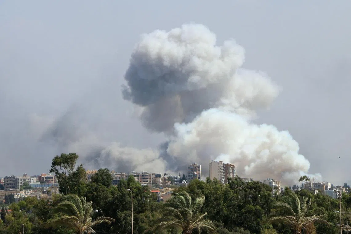 Smoke billowing from a site targeted by Israeli shelling in the southern Lebanese village of Burj el-Shmali, on Sept 23, 2024.
