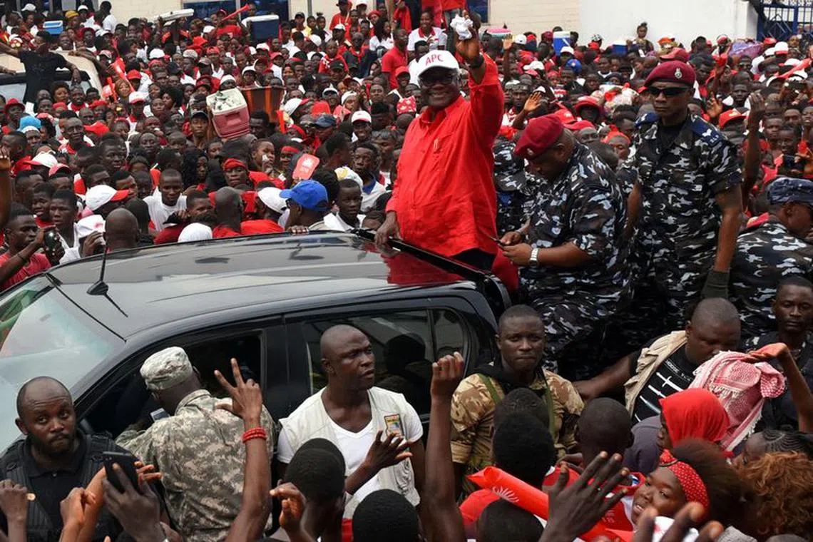 FILE PHOTO: President of Sierra Leone Ernest Bai Koroma waves to supporters of the ruling All Peoples Congress (APC) party during a rally ahead of the March 7 presidential election in Makeni, Sierra Leone March 5, 2018. REUTERS/Olivia Acland/File Photo