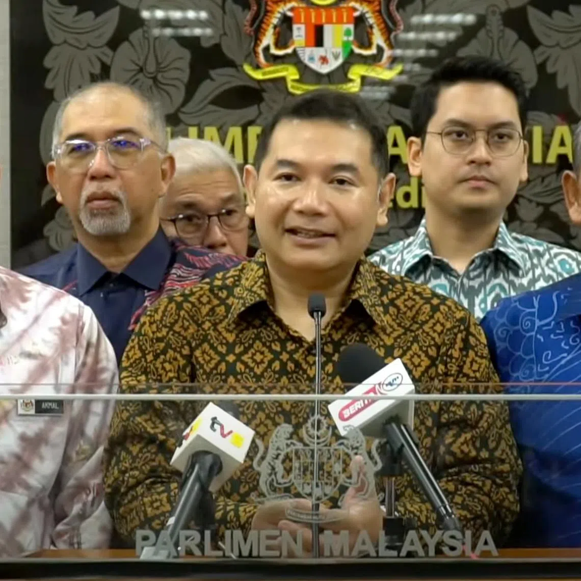 Former Malaysian Cabinet minister Rafizi Ramli (centre) said the attack was “a warning to me not to speak out on certain issues”.