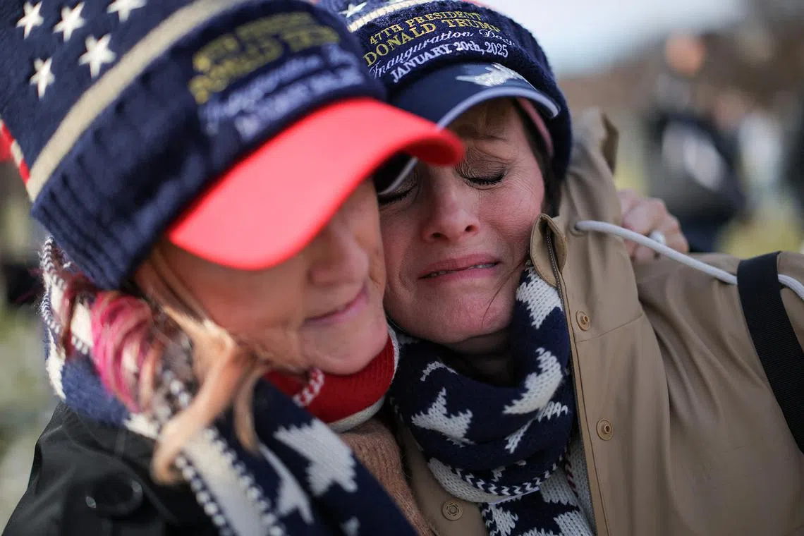 Tammy Holt and Vicky Askew, from Alabama, reacting after Donald Trump was sworn in at his inauguration ceremony for his second presidential term, in Washington, on Jan 20, 2025. 