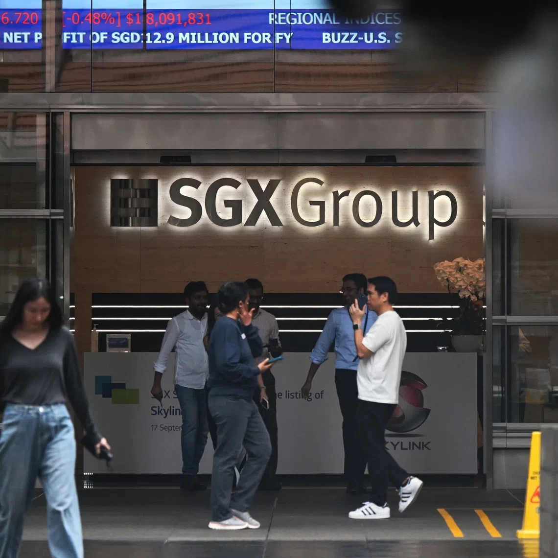Pixgeneric / Generic pix of the lunchtime crowd / office workers with the SGX logo at the SGX Centre 1, located in Shenton Way, on Sep 17, 2025.