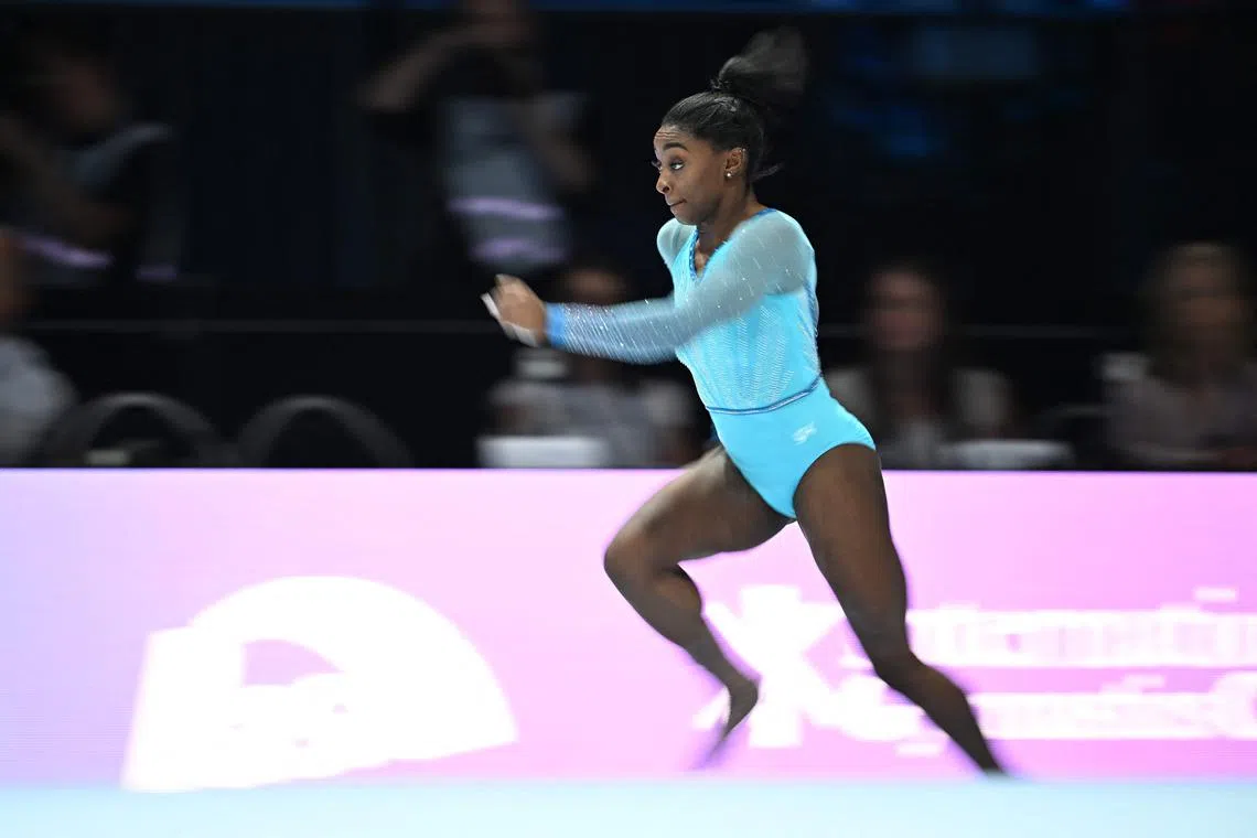 Simone Biles competes in the floor event during the women's qualifying session at the Gymnastics World Championships in Antwerp, Belgium.