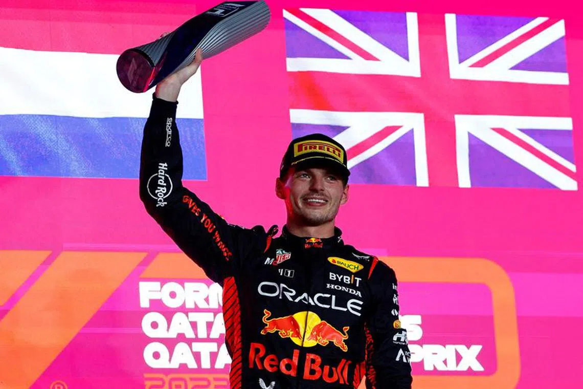 Formula One F1 - Qatar Grand Prix - Lusail International Circuit, Lusail, Qatar - October 8, 2023 First placed Max Verstappen of Red Bull celebrates with his trophy on the podium after the race REUTERS/Rula Rouhana/File Photo