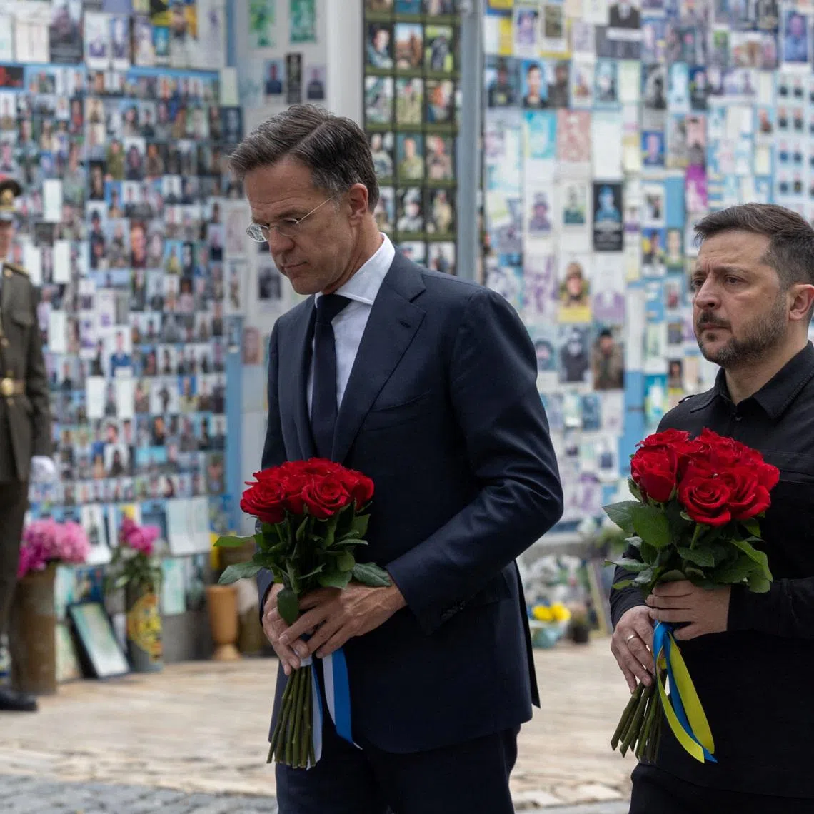 Ukraine's President Volodymyr Zelensky and NATO Secretary-General Mark Rutte visit the Wall of Remembrance of the Fallen Defenders of Ukraine on June 3 outside the St Michael's Cathedral in Kyiv, Ukraine.