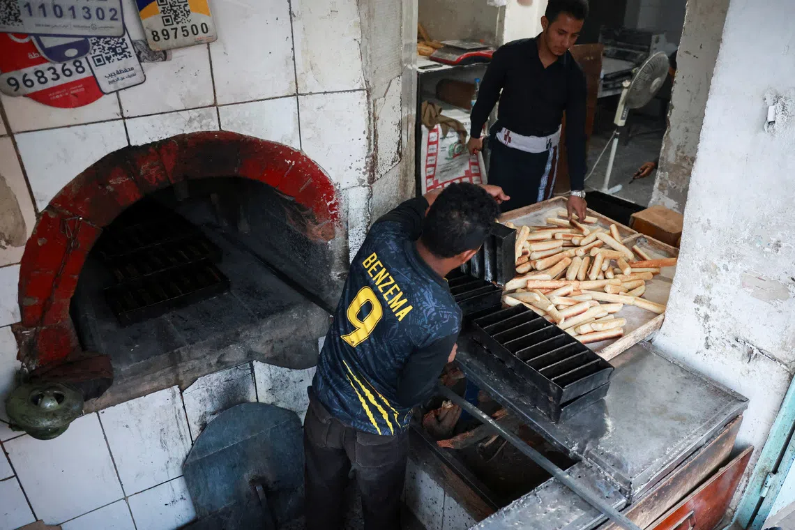 Bakers make loaves of bread at a bakery shop as the World Food Programme says three-in-four families in parts of Yemen are going hungry due to the impact of a surge in fighting, in Sanaa, Yemen, October 2, 2026. REUTERS/Stringer