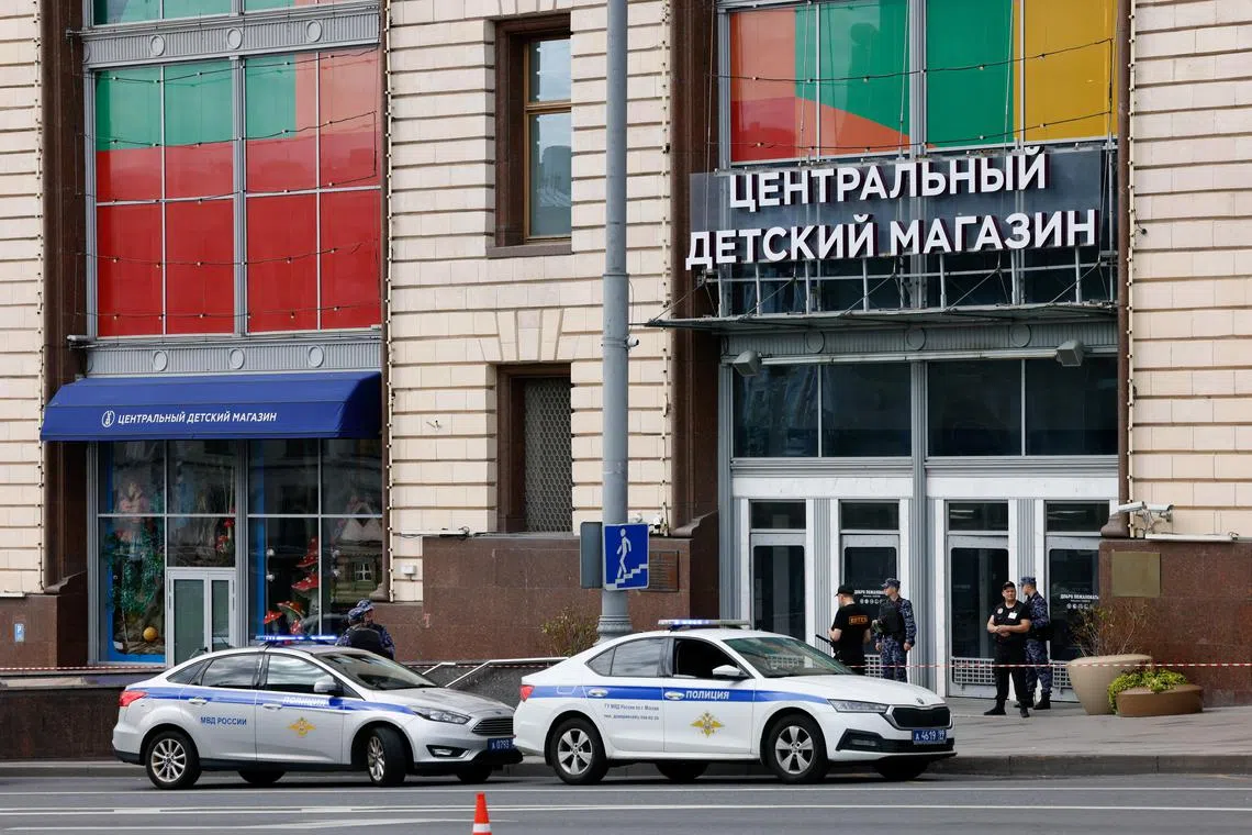 Police officers outside the Central Children's Store, following a blast that was reportedly caused by a gas cylinder explosion.