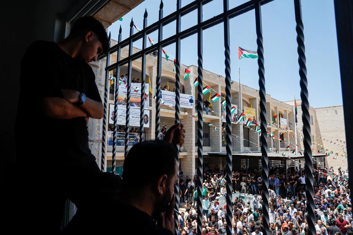 People attend the funerals of Sayfollah Kamel Musallet, a Palestinian-American man who was beaten to death by settlers, and Mohammad Al-Shalabi, a man who was shot dead by Israeli forces, according to the Palestinian Health Ministry, near Ramallah, in the Israel-occupied West Bank July 13, 2025. REUTERS/Ammar Awad