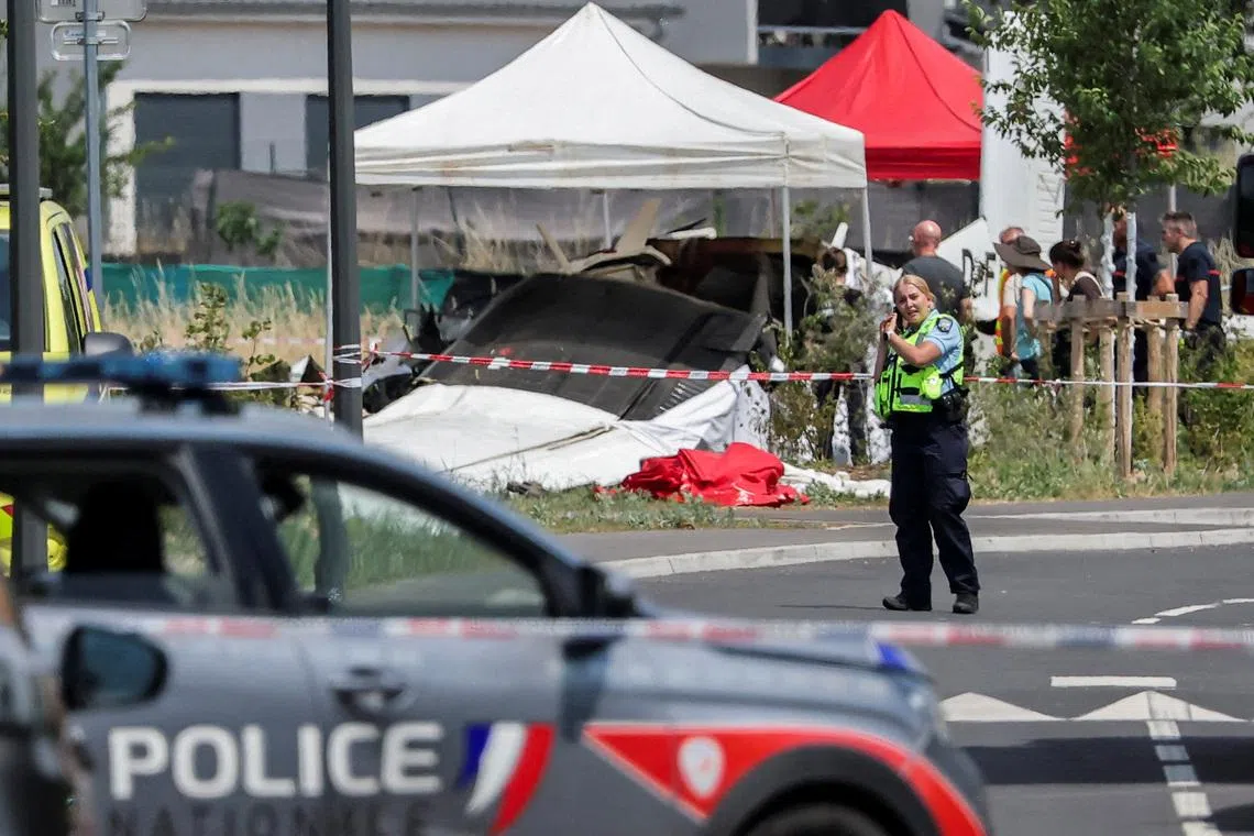 A rescue worker at the site of the plane crash in Tomblaine, France.