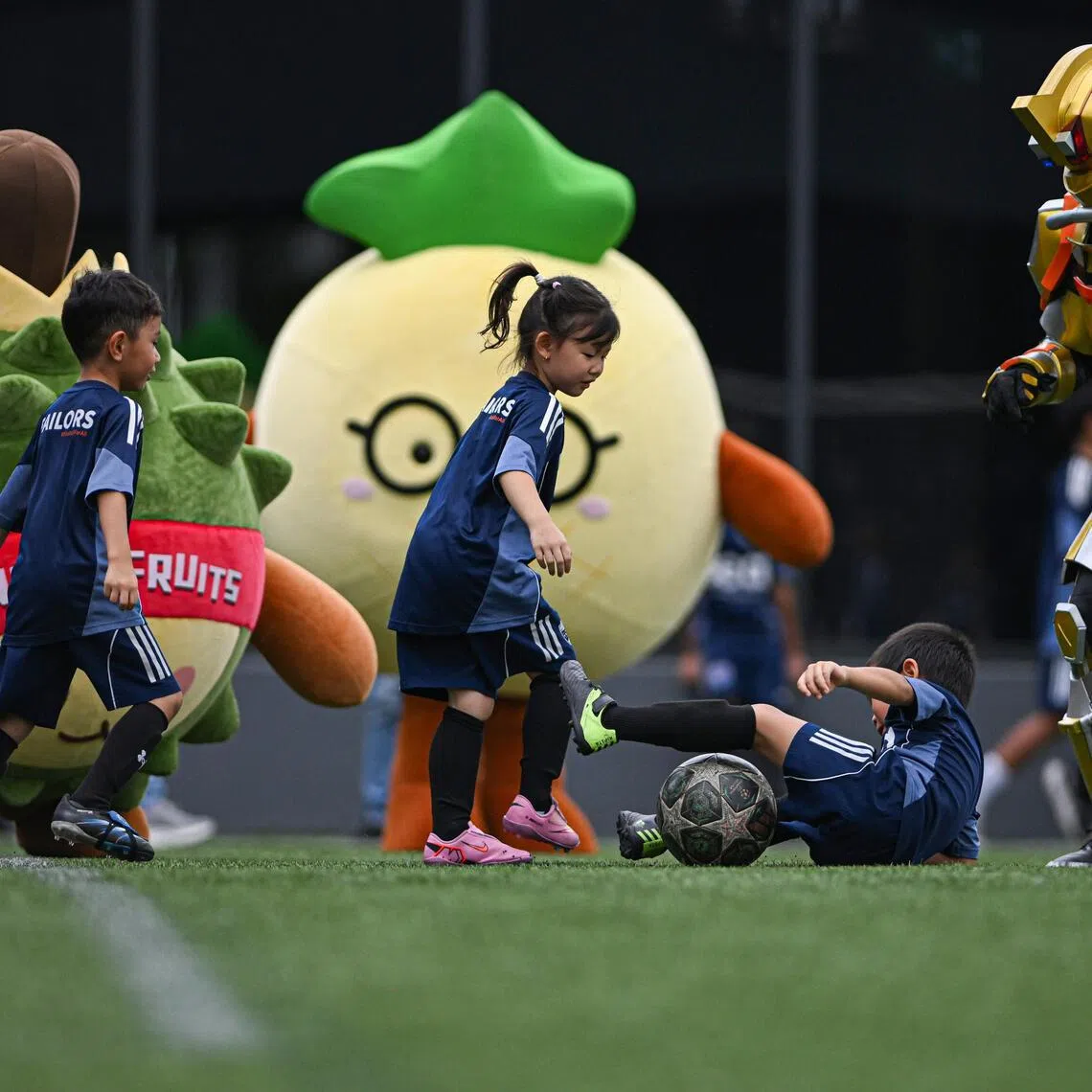 Singaporean social enterprise Wow Movement organises a football match between mascots and six-year-olds from Lion City Sailors Academy on March 25, 2026, ahead of the 2026 FIFA World Cup.