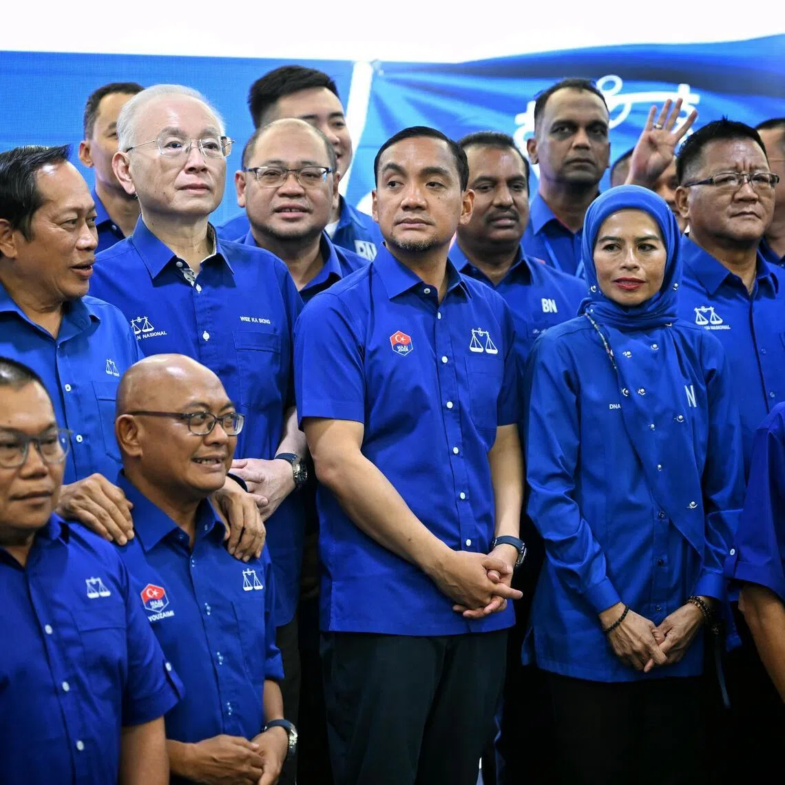 Caretaker Johor Menteri Besar Onn Hafiz Ghazi (third from right) with BN candidates for the state of Johor on June 24.