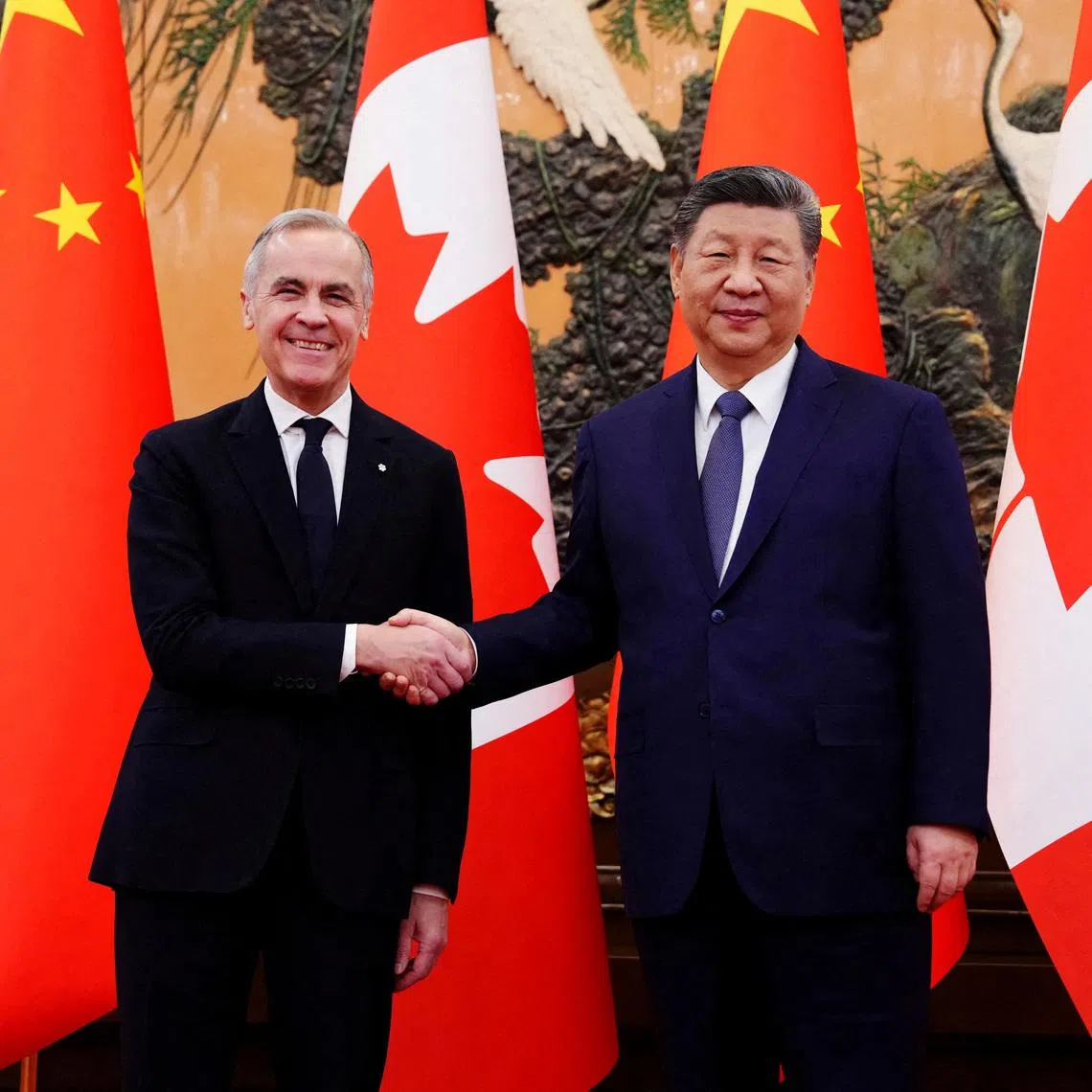 Canadian Prime Minister Mark Carney shakes hands with President of China Xi Jinping at the Great Hall of the People in Beijing, China on Friday, Jan. 16, 2026.  Sean Kilpatrick/Pool via REUTERS/File Photo