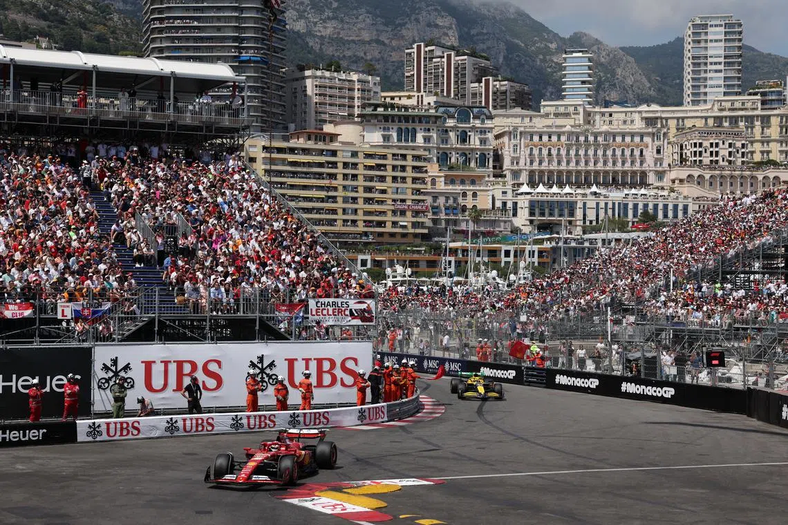 FILE PHOTO: Formula One F1 - Monaco Grand Prix - Circuit de Monaco, Monaco - May 26, 2024 Ferrari's Charles Leclerc leads as a steward waves a red flag to stop the race REUTERS/Claudia Greco/Pool/File Photo