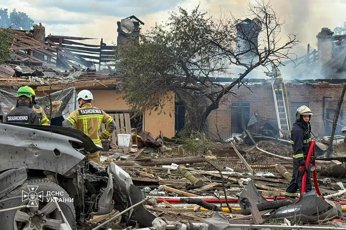 Ukrainian rescuers working at the site of a Russian missile strike in the Kyiv region on July 24.