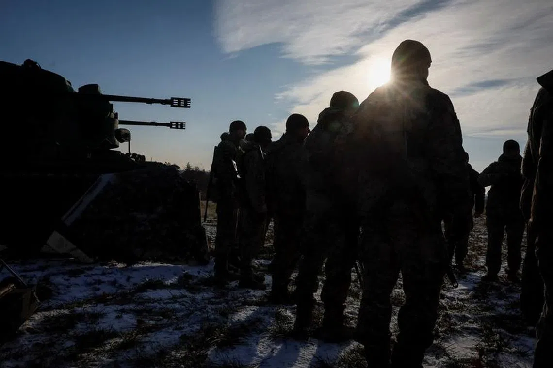 FILE PHOTO: Ukrainian servicemen from air defence unit stand at their position, amid Russia's attack on Ukraine, near Kyiv, Ukraine November 30, 2023. REUTERS/Gleb Garanich/File Photo