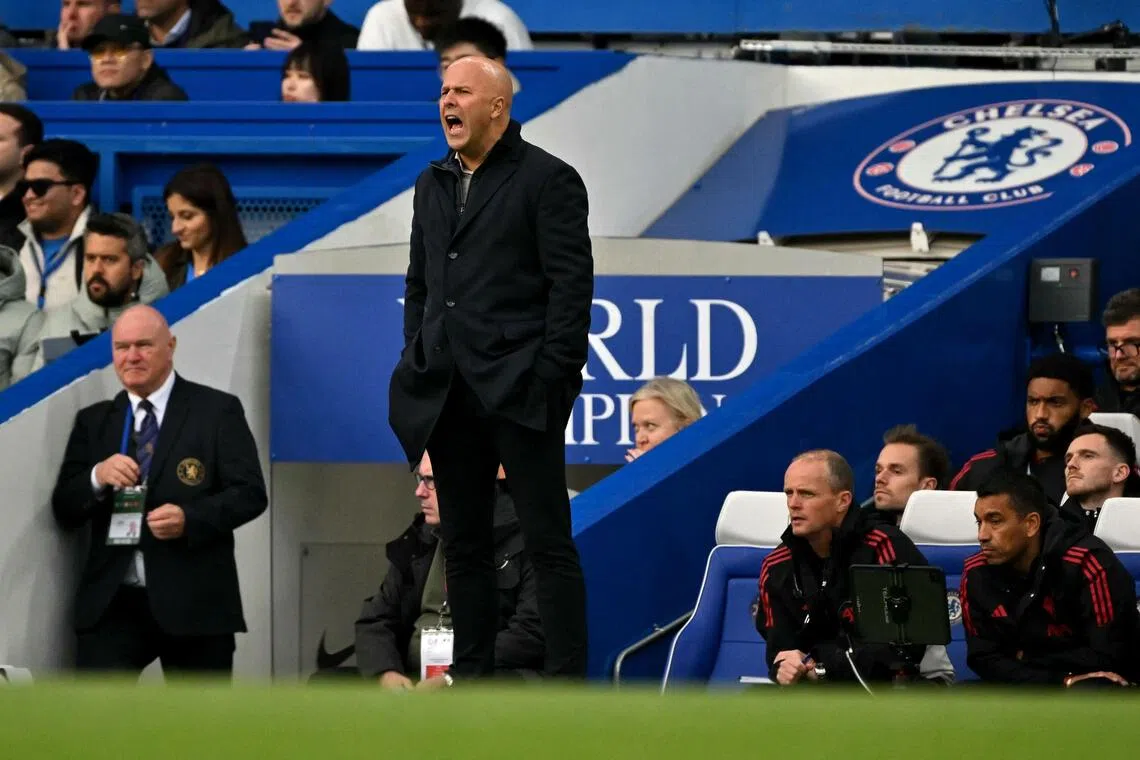 Liverpool manager Arne Slot shouts instructions to the players from the touchline during the English Premier League match against Chelsea.