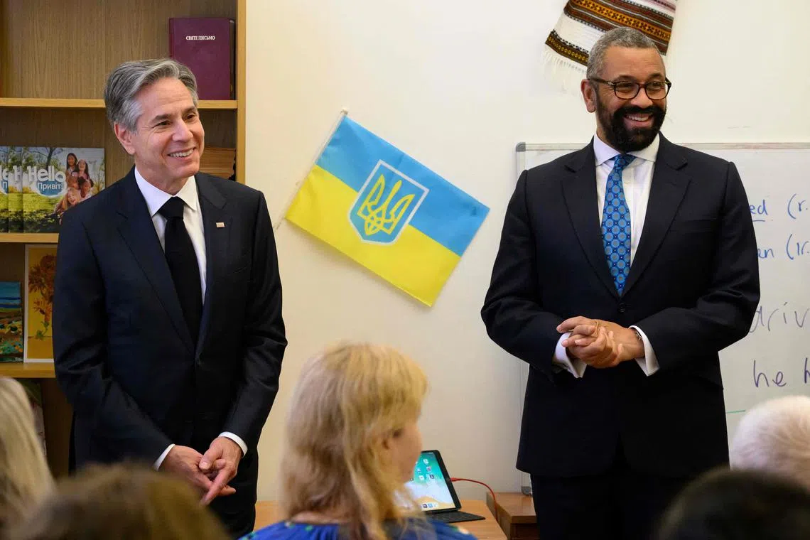 US Secretary of State Antony Blinken (L) and Britain's Foreign Secretary James Cleverly (R) attend an event for "World Refugee Day" at the Ukrainian Welcome Center, in London, on June 20, 2023. US Secretary of State Antony Blinken arrives in London on June 20, 2023 to attend the International Ukraine recovery conference. (Photo by Leon Neal / POOL / AFP)