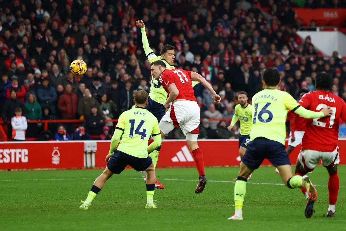 Nottingham Forest's Chris Wood scores their third goal against Southampton.
