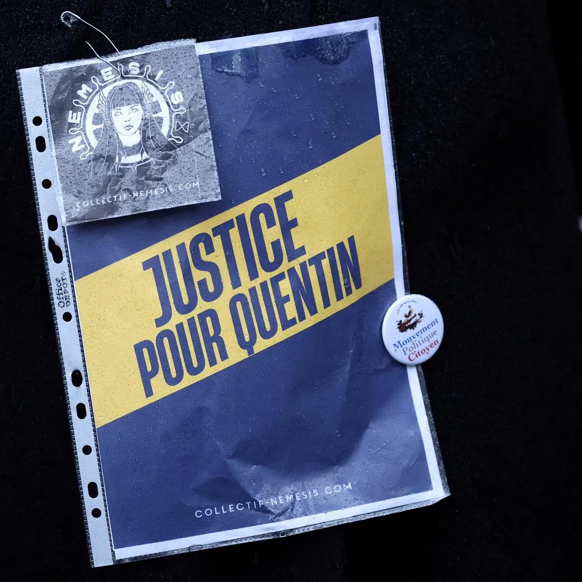 FILE PHOTO: A sign as people gather to pay tribute to Quentin, an activist who died from injuries sustained during a beating on February 12 in Lyon, during a demonstration at the Place de la Sorbonne in Paris, France, February 15, 2026. REUTERS/Stephane Mahe/File Photo