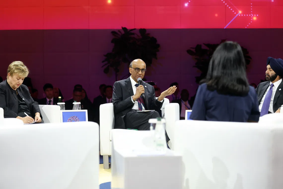Singapore President Tharman Shanmugaratnam (centre) with IMF managing director Kristalina Georgieva (left), and World Bank Group president Ajay Banga (right) at the panel discussion on jobs and AI on Oct 12.