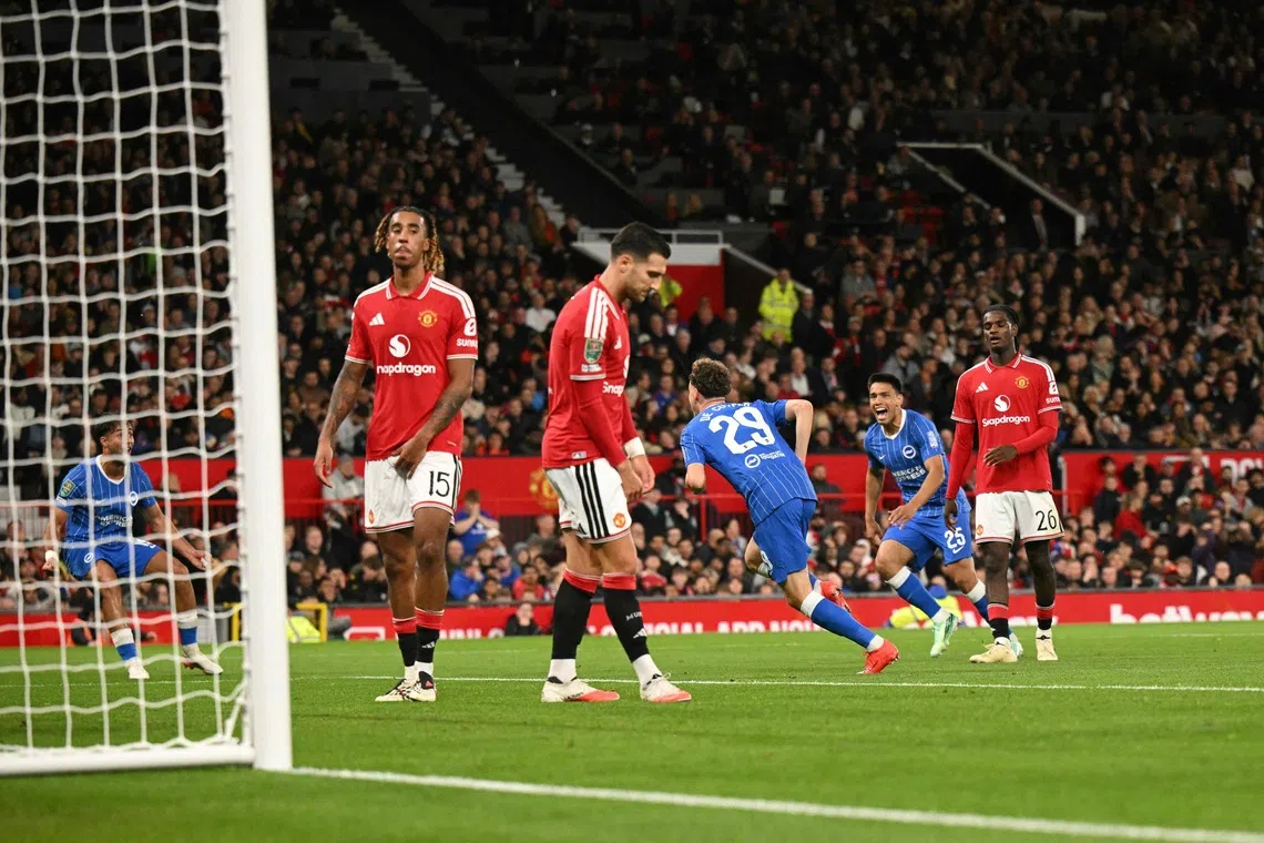 Brighton’s Belgian defender Maxim De Cuyper celebrates scoring the team’s third goal against Manchester United at Old Trafford.