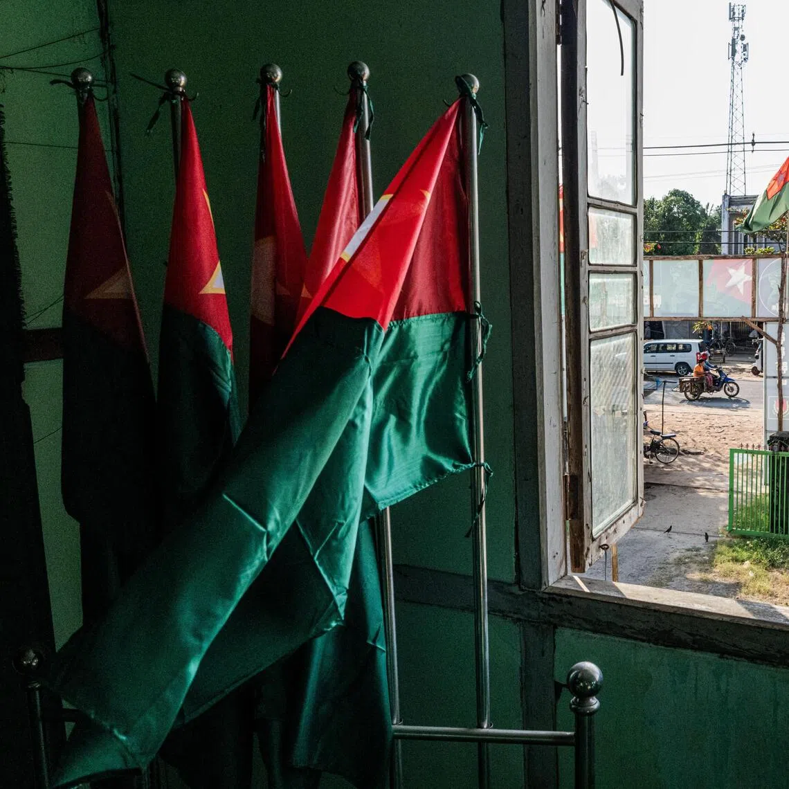 Flags representing the Union Solidarity and Development Party, the only party assured of winning in Myanmar's upcoming elections, at a headquarters near Yangon.