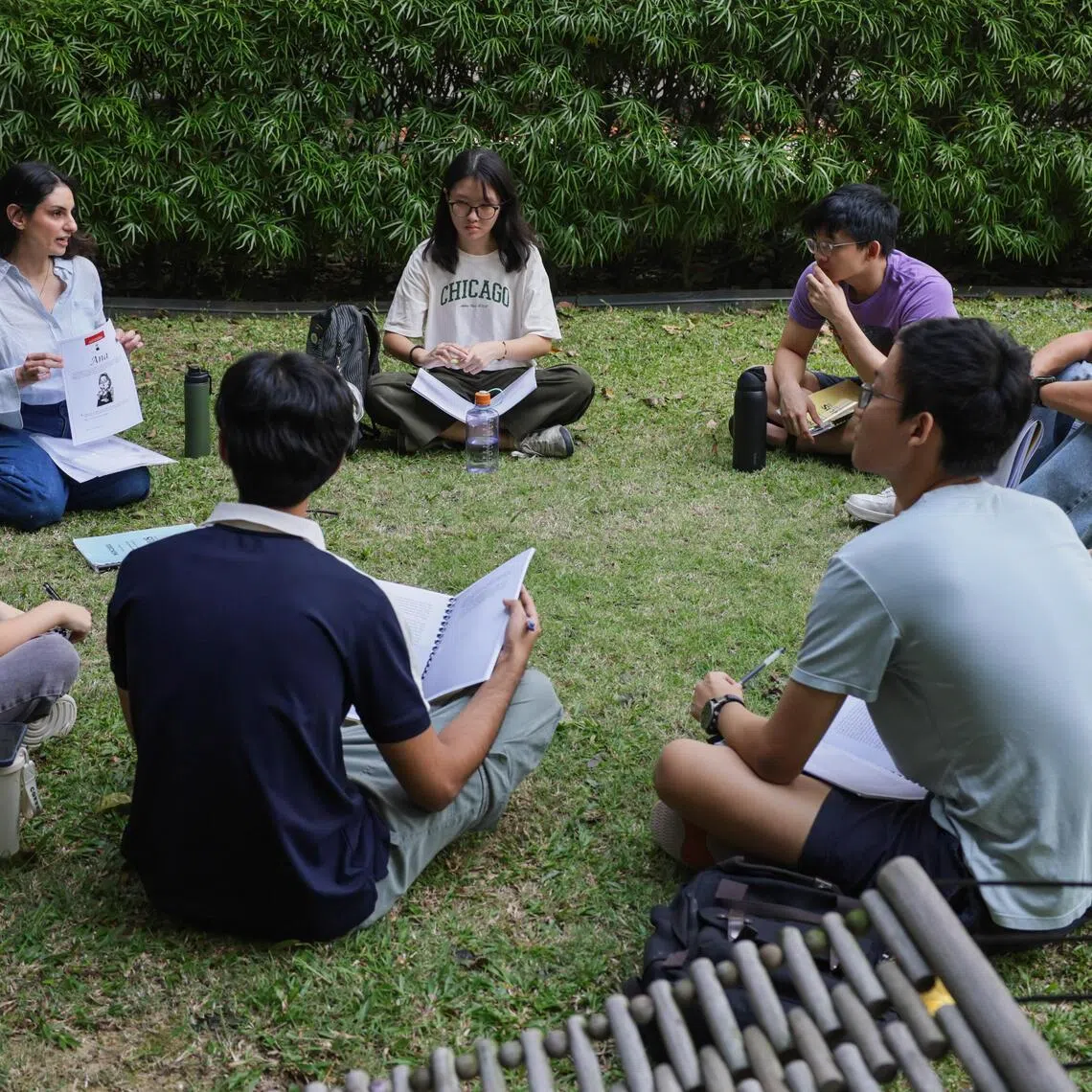 ST20260126_202607200476: Gin Tay/ smcollege01/Shermaine Ang JN/
Dr. Samar Faruqi (second from left) conducting her class Global Narratives outdoors with NUS students at NUS College on Jan 26, 2026
