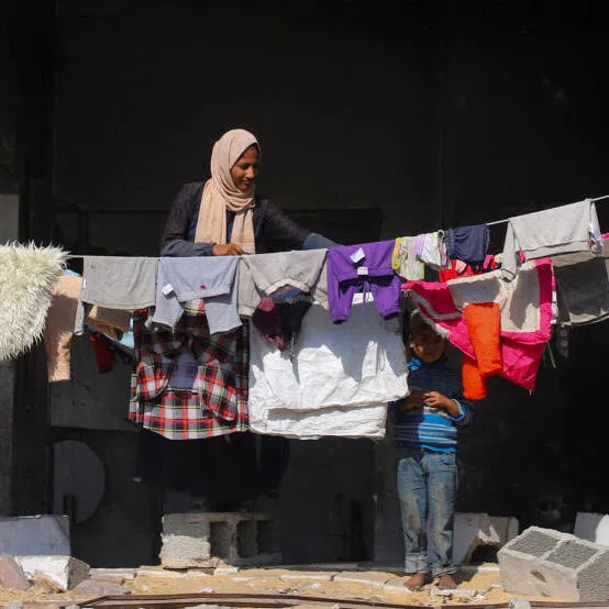 Palestinians shelter in a building of the Islamic University, amid a ceasefire between Israel and Hamas, in Gaza City, on Oct 16.