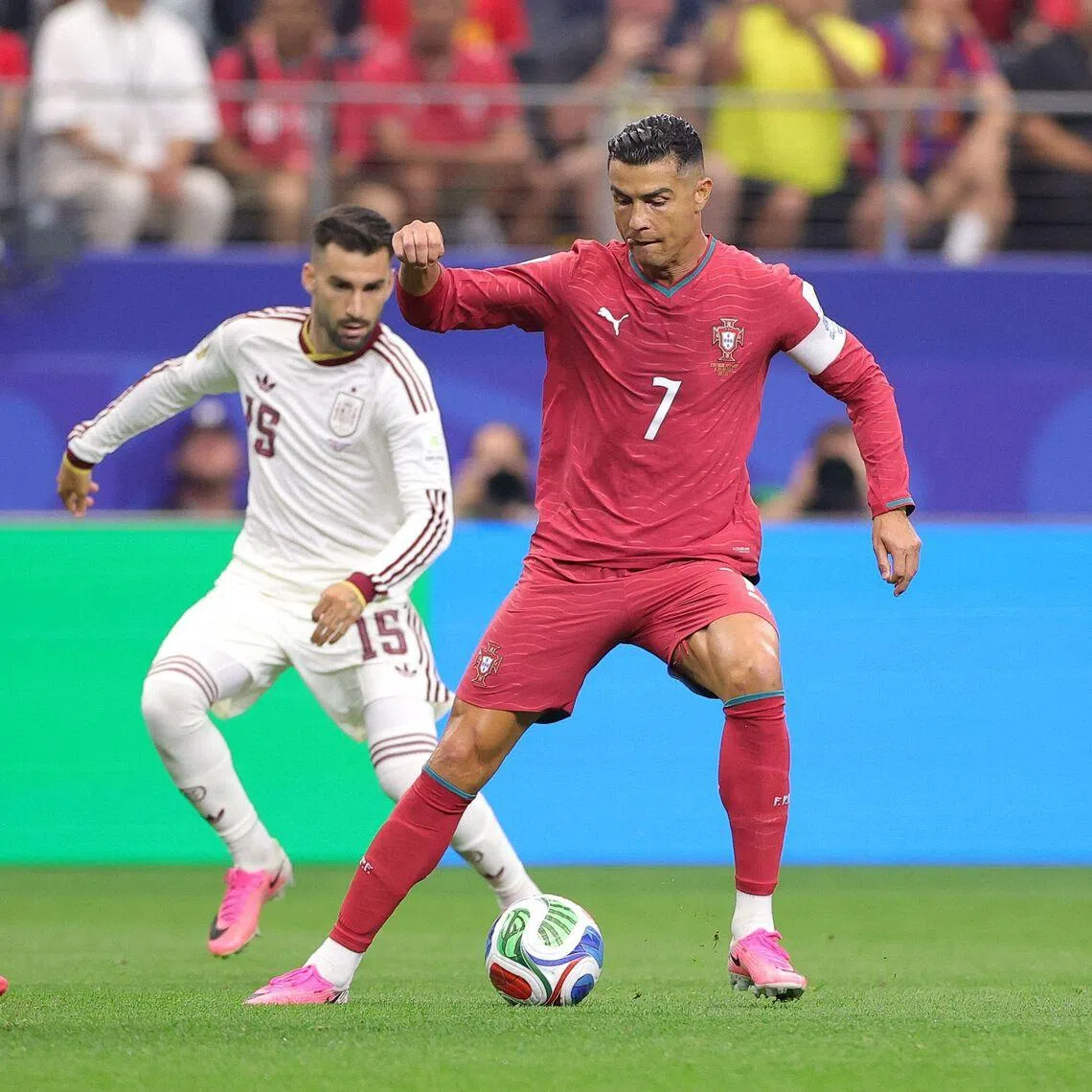 Cristiano Ronaldo (right) controls the ball against Spain’s Aymeric Laporte (left) and Alex Baena during the match on July 6.
