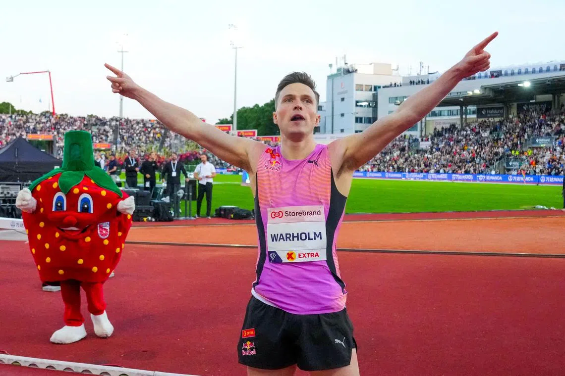 Athletics - Diamond League - Oslo - Bislett Stadium, Oslo, Norway - June 12, 2025 Norway's Karsten Warholm celebrates winning the men's 300m hurdles Heiko Junge/NTB via REUTERS