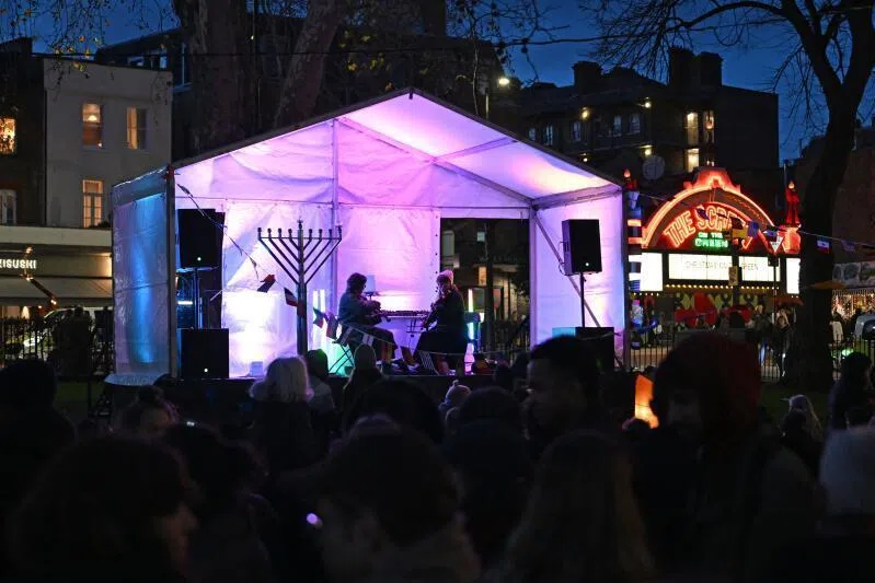 Musicians play at the Menorah Lighting, celebrating the Festival of Chanukah in Islington, London on Dec 14.